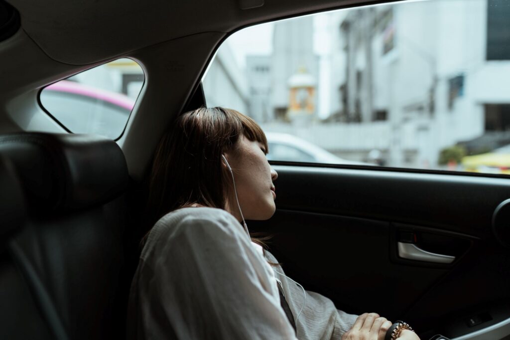 Woman sleeping in the car