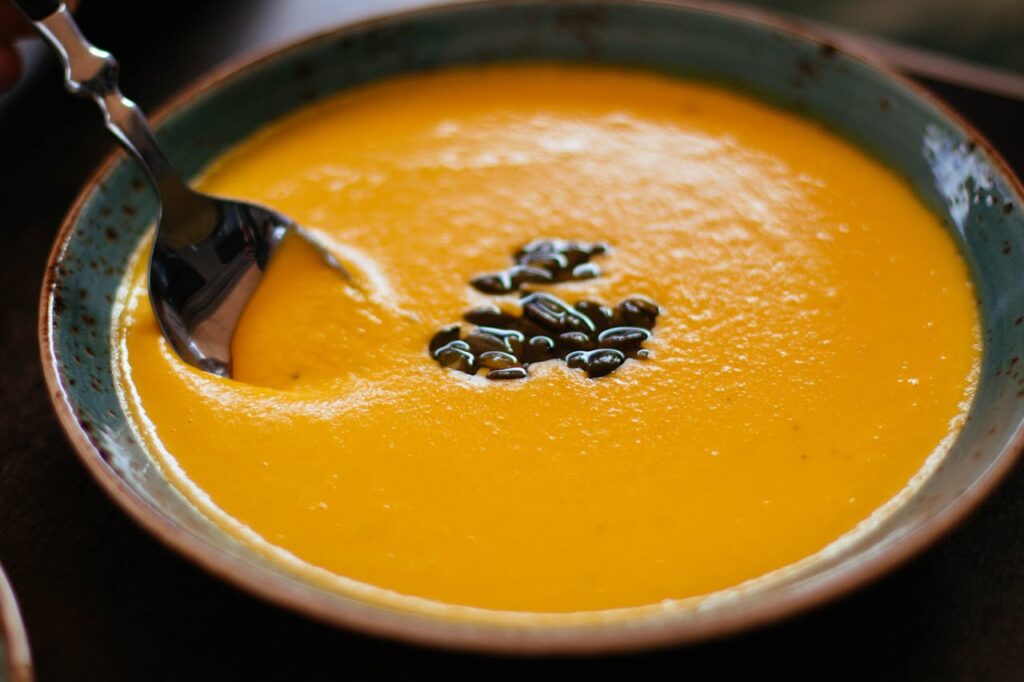 Soup with mango salad
